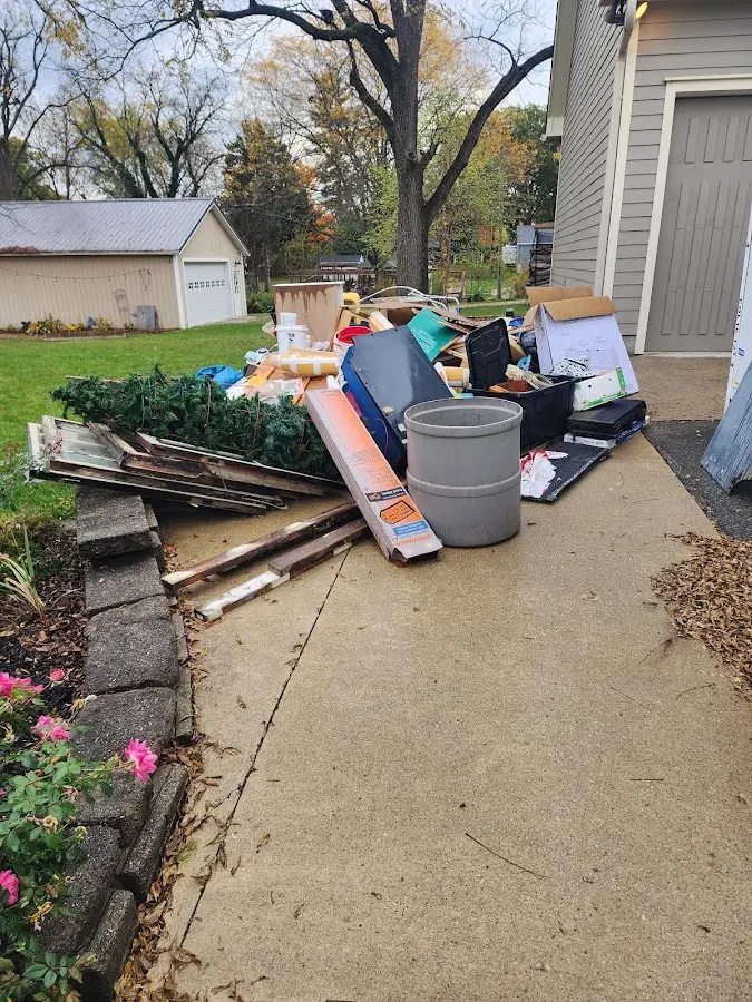 Dumpster being loaded with debris for 12 Yard Dumpster Rental in Lysander